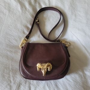 C. Wonder Oxblood Ram Head Crossbody Saddlebag